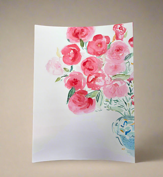 Floral painting on a stand against a beige wall